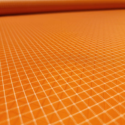 High-quality image showcasing my Carrot Orange 210D UHMWPE Gridstop Nylon fabric, emphasizing its lightweight, durable woven texture and unique waterproof properties. The image highlights the fabric's intricate UHMWPE fiber grid, its robust 210D denier thickness, and the dual protective coating – 1000mm PU on the back and DWR on the front. Ideal for visualizing the fabric's application in making resilient, weather-resistant outdoor gear like backpacks, fanny packs, and reinforcement areas.