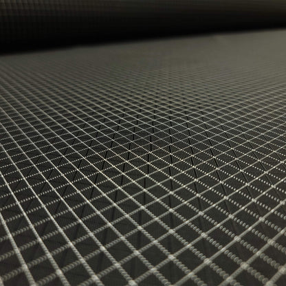 High-quality image showcasing my Eerie Black 210D UHMWPE Gridstop Nylon fabric, emphasizing its lightweight, durable woven texture and unique waterproof properties. The image highlights the fabric's intricate UHMWPE fiber grid, its robust 210D denier thickness, and the dual protective coating – 1000mm PU on the back and DWR on the front. Ideal for visualizing the fabric's application in making resilient, weather-resistant outdoor gear like backpacks, fanny packs, and reinforcement areas.