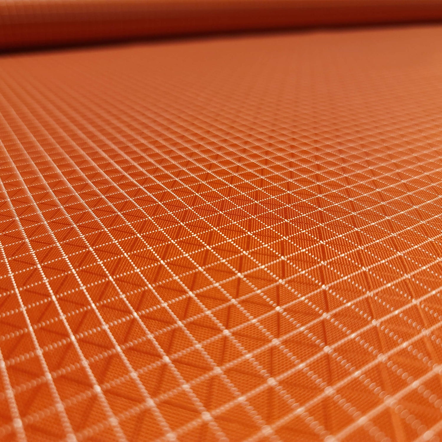 High-quality image showcasing my Mars Orange 210D UHMWPE Gridstop Nylon fabric, emphasizing its lightweight, durable woven texture and unique waterproof properties. The image highlights the fabric's intricate UHMWPE fiber grid, its robust 210D denier thickness, and the dual protective coating – 1000mm PU on the back and DWR on the front. Ideal for visualizing the fabric's application in making resilient, weather-resistant outdoor gear like backpacks, fanny packs, and reinforcement areas.