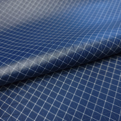 High-quality image showcasing my Midnight Navy 210D UHMWPE Gridstop Nylon fabric, emphasizing its lightweight, durable woven texture and unique waterproof properties. The image highlights the fabric's intricate UHMWPE fiber grid, its robust 210D denier thickness, and the dual protective coating – 1000mm PU on the back and DWR on the front. Ideal for visualizing the fabric's application in making resilient, weather-resistant outdoor gear like backpacks, fanny packs, and reinforcement areas.