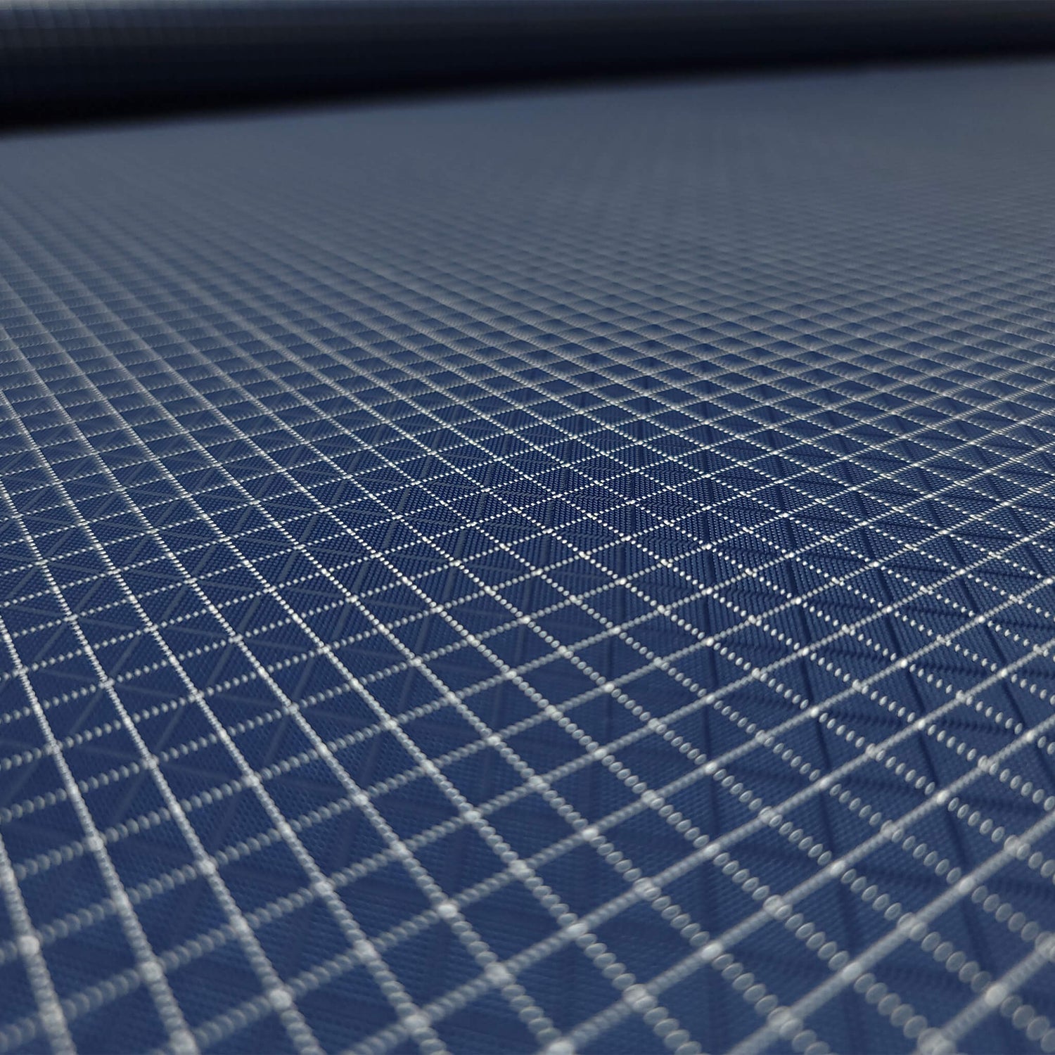 High-quality image showcasing my Midnight Navy 210D UHMWPE Gridstop Nylon fabric, emphasizing its lightweight, durable woven texture and unique waterproof properties. The image highlights the fabric's intricate UHMWPE fiber grid, its robust 210D denier thickness, and the dual protective coating – 1000mm PU on the back and DWR on the front. Ideal for visualizing the fabric's application in making resilient, weather-resistant outdoor gear like backpacks, fanny packs, and reinforcement areas.