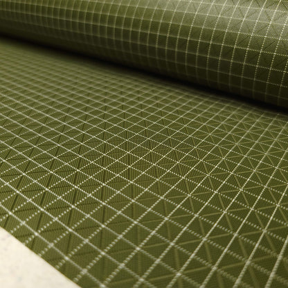 High-quality image showcasing my Olive Green 210D UHMWPE Gridstop Nylon fabric, emphasizing its lightweight, durable woven texture and unique waterproof properties. The image highlights the fabric's intricate UHMWPE fiber grid, its robust 210D denier thickness, and the dual protective coating – 1000mm PU on the back and DWR on the front. Ideal for visualizing the fabric's application in making resilient, weather-resistant outdoor gear like backpacks, fanny packs, and reinforcement areas.