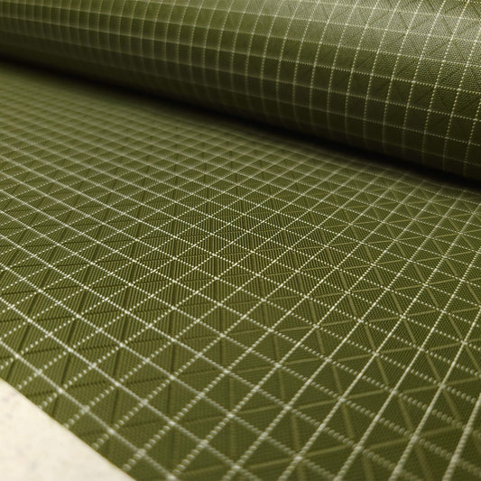 High-quality image showcasing my Olive Green 210D UHMWPE Gridstop Nylon fabric, emphasizing its lightweight, durable woven texture and unique waterproof properties. The image highlights the fabric's intricate UHMWPE fiber grid, its robust 210D denier thickness, and the dual protective coating – 1000mm PU on the back and DWR on the front. Ideal for visualizing the fabric's application in making resilient, weather-resistant outdoor gear like backpacks, fanny packs, and reinforcement areas.