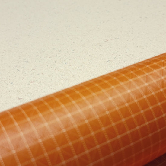 High-quality video showcasing my Carrot Orange 210D UHMWPE Gridstop Nylon fabric, emphasizing its lightweight, durable woven texture and unique waterproof properties. The video highlights the fabric's intricate UHMWPE fiber grid, its robust 210D denier thickness, and the dual protective coating – 1000mm PU on the back and DWR on the front. Ideal for visualizing the fabric's application in making resilient, weather-resistant outdoor gear like backpacks, fanny packs, and reinforcement areas.