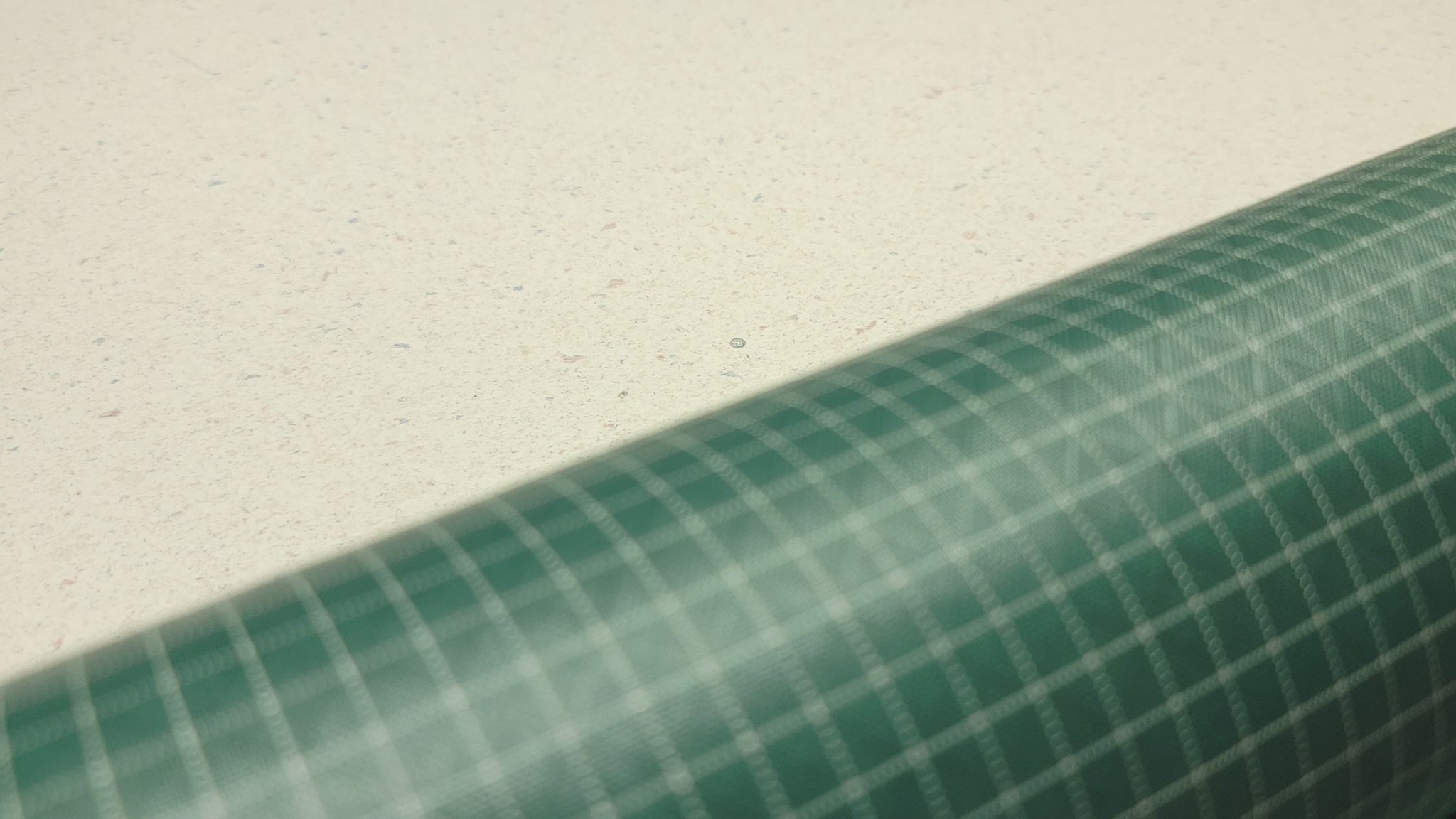 High-quality video showcasing my Pine Green 210D UHMWPE Gridstop Nylon fabric, emphasizing its lightweight, durable woven texture and unique waterproof properties. The video highlights the fabric's intricate UHMWPE fiber grid, its robust 210D denier thickness, and the dual protective coating – 1000mm PU on the back and DWR on the front. Ideal for visualizing the fabric's application in making resilient, weather-resistant outdoor gear like backpacks, fanny packs, and reinforcement areas.