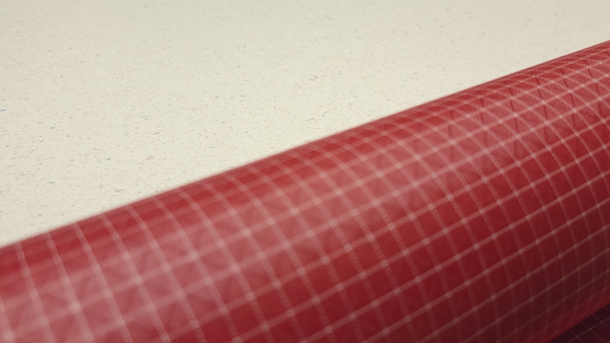 High-quality video showcasing my Brick Red 210D UHMWPE Gridstop Nylon fabric, emphasizing its lightweight, durable woven texture and unique waterproof properties. The video highlights the fabric's intricate UHMWPE fiber grid, its robust 210D denier thickness, and the dual protective coating – 1000mm PU on the back and DWR on the front. Ideal for visualizing the fabric's application in making resilient, weather-resistant outdoor gear like backpacks, fanny packs, and reinforcement areas.