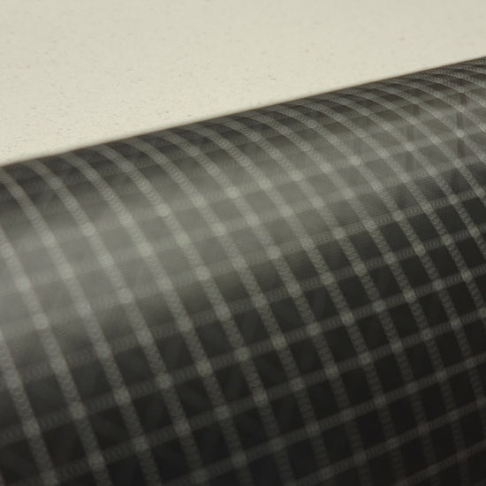 High-quality video showcasing Eerie Black 210D UHMWPE Gridstop Nylon fabric, emphasizing its lightweight, durable woven texture and unique waterproof properties. The video highlights the fabric's intricate UHMWPE fiber grid, its robust 210D denier thickness, and the dual protective coating – 1000mm PU on the back and DWR on the front. Ideal for visualizing the fabric's application in making resilient, weather-resistant outdoor gear like backpacks, fanny packs, and reinforcement areas.